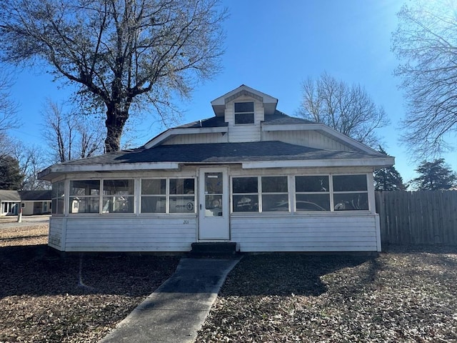 view of front of home with a sunroom