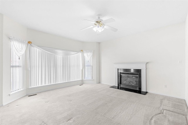 carpeted living room featuring ceiling fan