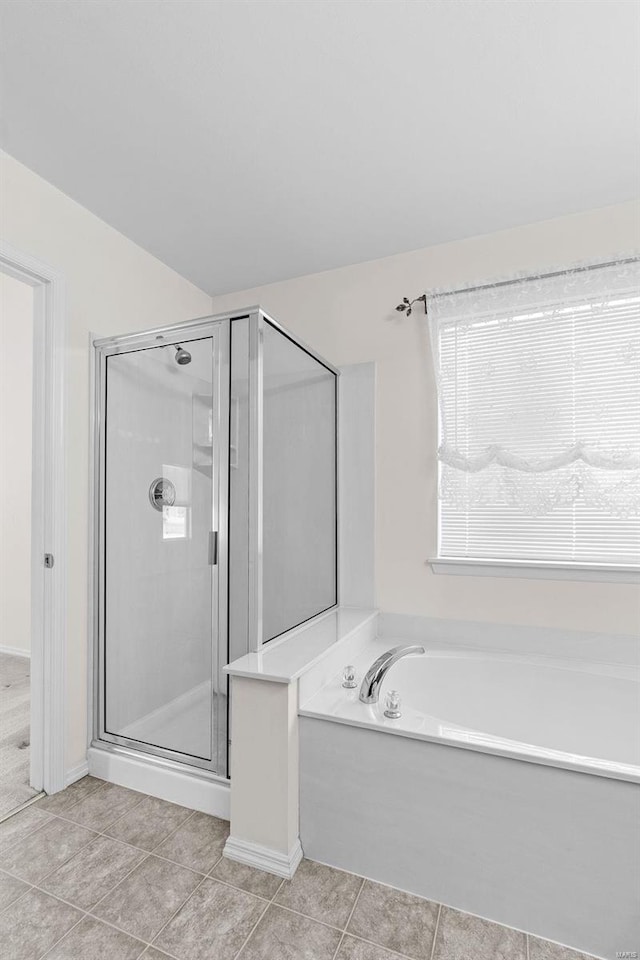 bathroom featuring tile patterned floors and plus walk in shower