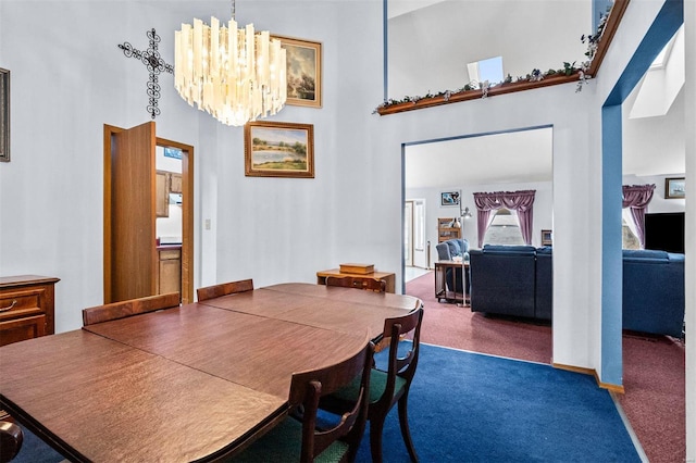 dining room with dark carpet, a chandelier, and a high ceiling