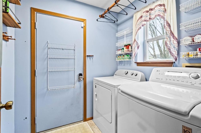 clothes washing area featuring washing machine and dryer