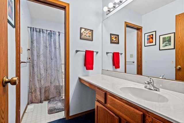 bathroom featuring shower / tub combo with curtain and vanity