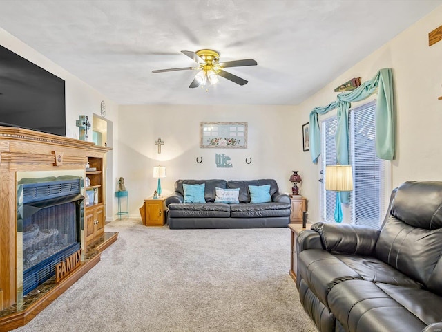 living room with ceiling fan and carpet flooring