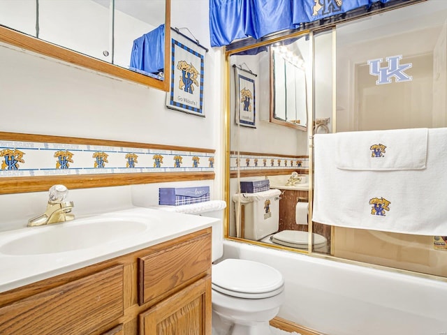 full bathroom featuring enclosed tub / shower combo, vanity, and toilet