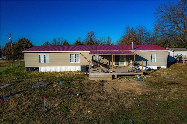 view of front of home featuring central AC unit and a deck