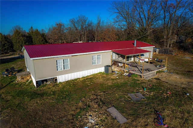 exterior space featuring central AC and a deck