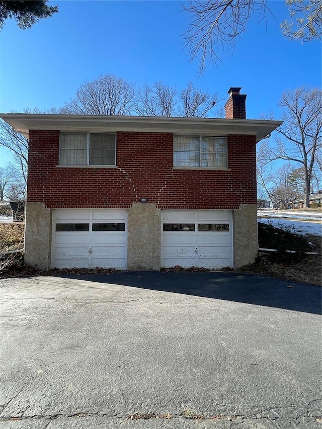 view of side of home featuring a garage