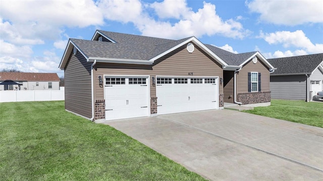 ranch-style house featuring roof with shingles, driveway, brick siding, and a front lawn