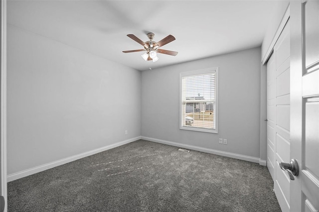 unfurnished bedroom with a ceiling fan, carpet, a closet, and baseboards