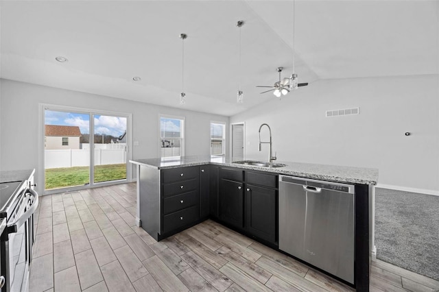 kitchen featuring a wealth of natural light, visible vents, stainless steel appliances, and a sink