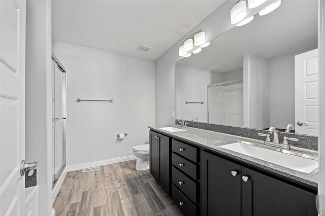 full bath featuring a stall shower, visible vents, and a sink