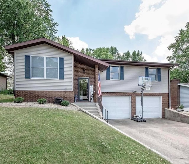 view of front of home with a garage and a front yard