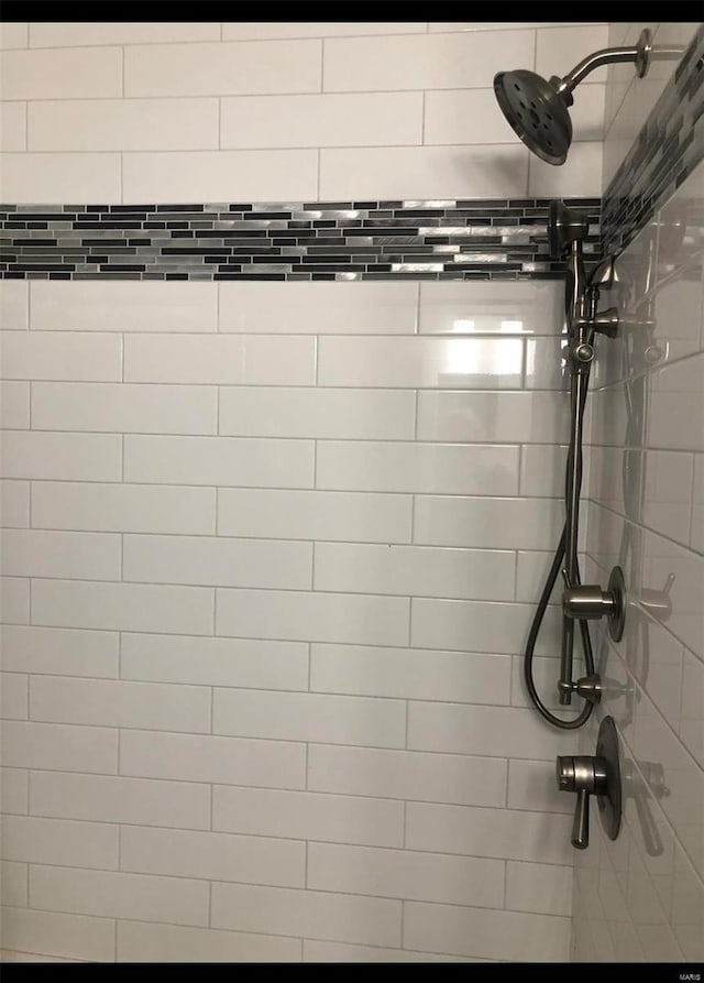 room details with a tile shower