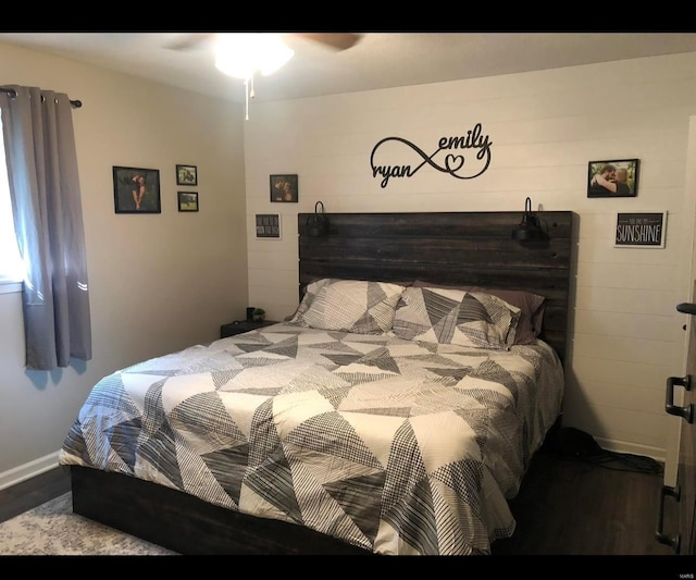 bedroom with hardwood / wood-style floors and ceiling fan