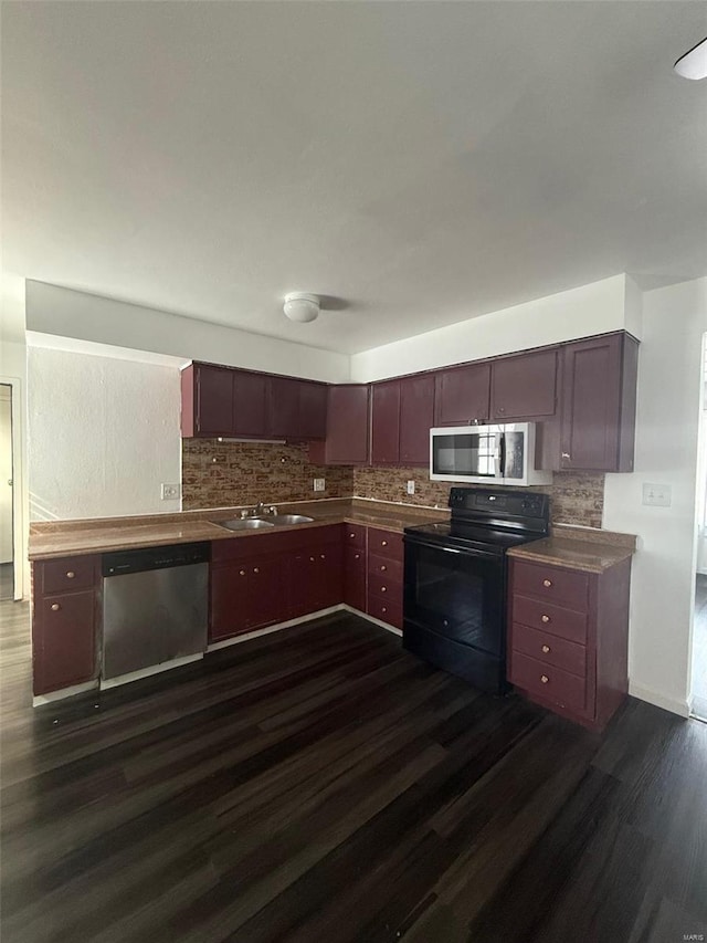 kitchen with sink, stainless steel appliances, and dark hardwood / wood-style floors