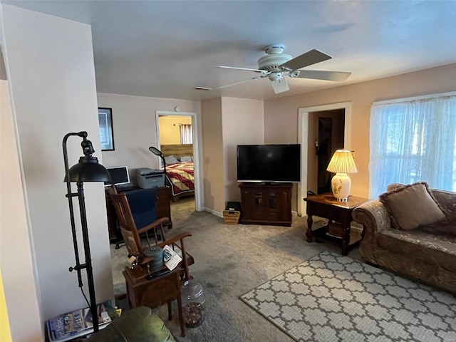 living room with ceiling fan and carpet floors