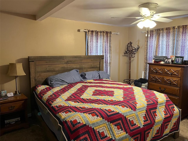 bedroom with beamed ceiling, ceiling fan, and carpet flooring