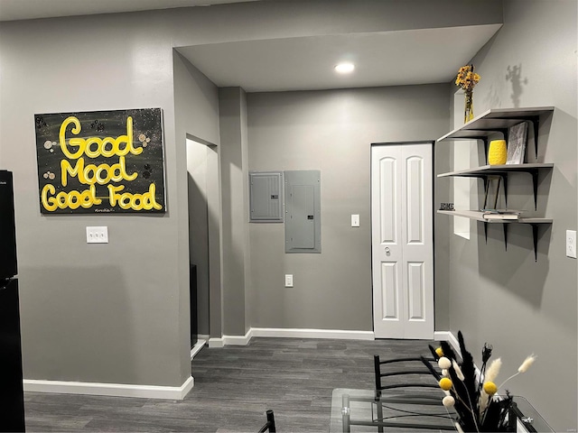 corridor featuring dark hardwood / wood-style flooring and electric panel