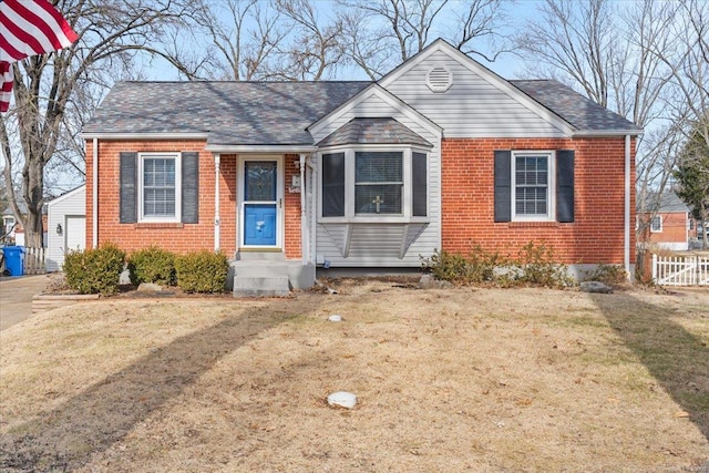 bungalow-style home featuring a front yard