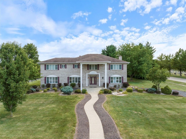 view of front of property with a front lawn