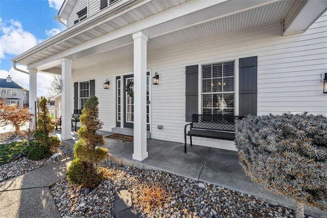 entrance to property featuring a porch