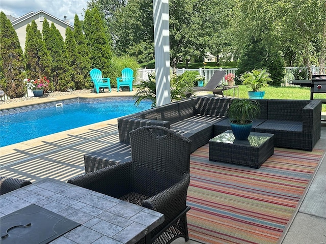 view of swimming pool featuring a patio and outdoor lounge area