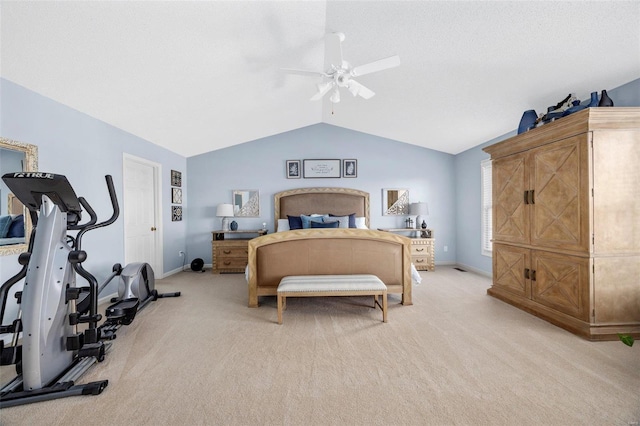 carpeted bedroom with ceiling fan and vaulted ceiling