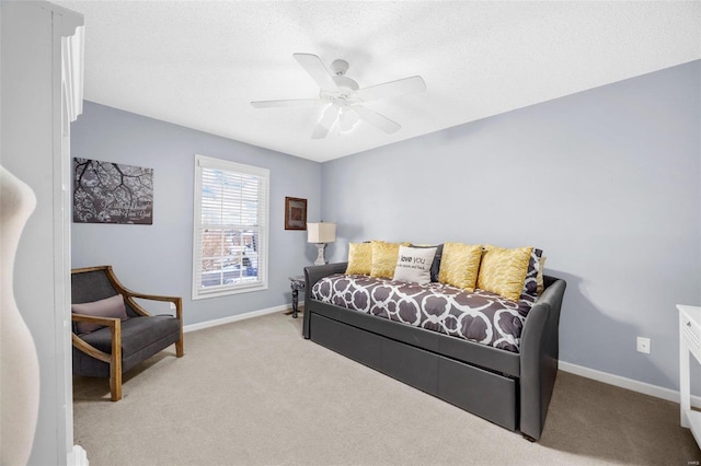 bedroom featuring light carpet and ceiling fan