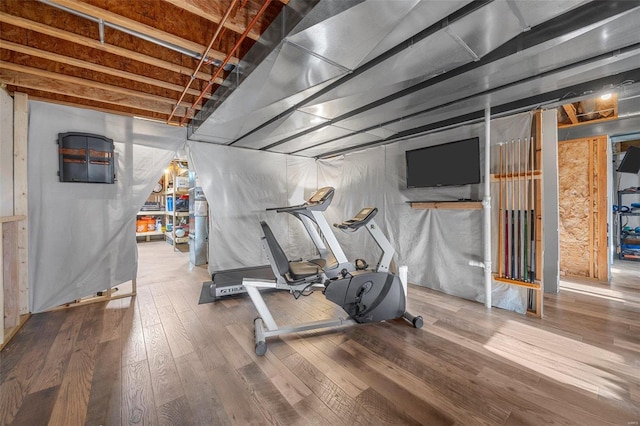 workout room with hardwood / wood-style floors