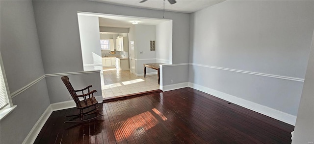 unfurnished room with hardwood / wood-style flooring and ceiling fan