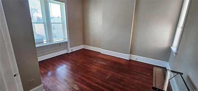 spare room with hardwood / wood-style floors