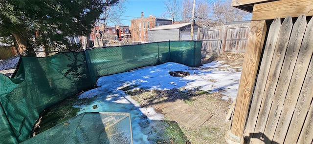 view of yard covered in snow