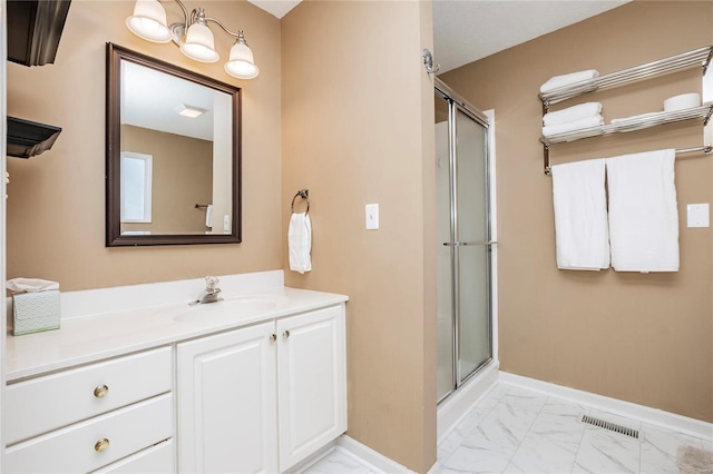 bathroom with vanity and an enclosed shower