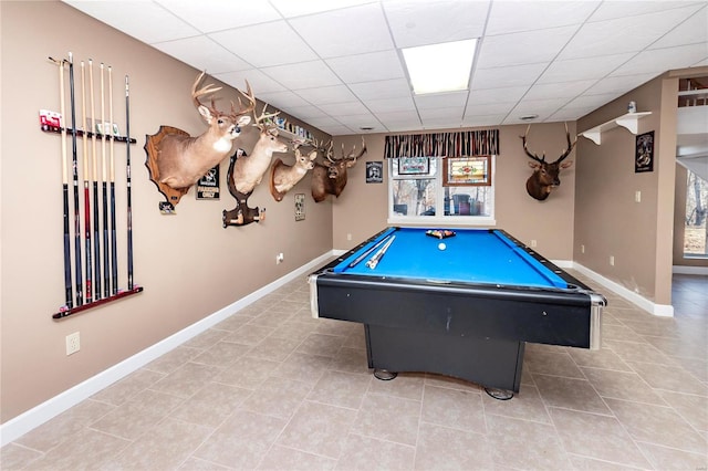 rec room with a paneled ceiling, pool table, and tile patterned flooring