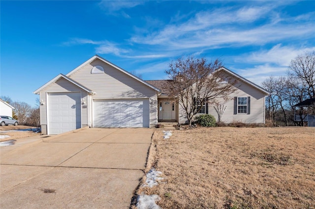 ranch-style home featuring a garage and a front yard