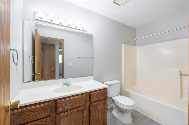 full bathroom with tile patterned flooring, vanity, washtub / shower combination, and toilet