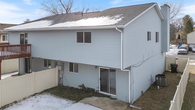 rear view of house with central AC