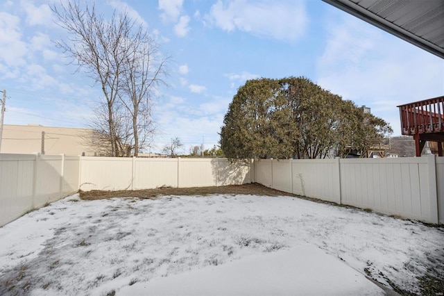 view of yard layered in snow