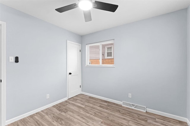 spare room with ceiling fan and light hardwood / wood-style flooring