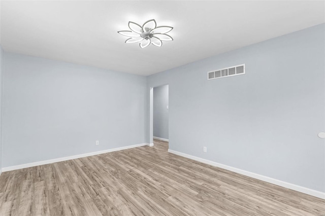 spare room featuring light wood-type flooring