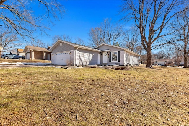 ranch-style house with a garage and a front lawn