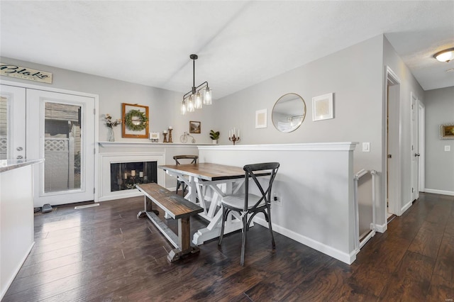 dining room with dark hardwood / wood-style flooring