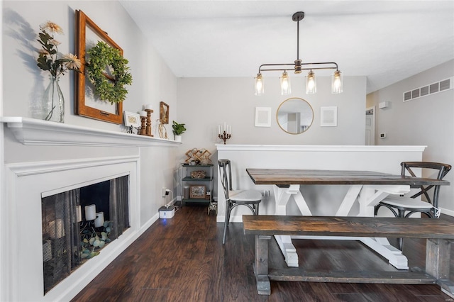 dining room featuring dark hardwood / wood-style flooring