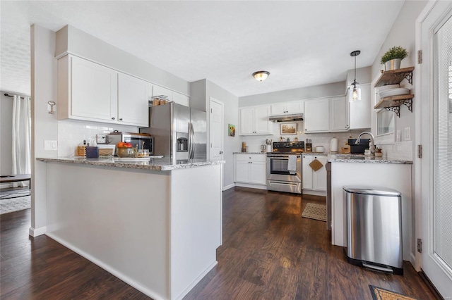 kitchen with stainless steel appliances, white cabinetry, and kitchen peninsula