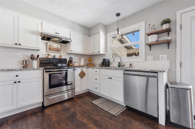 kitchen featuring appliances with stainless steel finishes, sink, and white cabinets