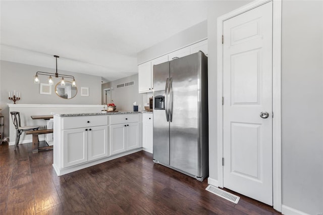 kitchen with white cabinetry, hanging light fixtures, dark hardwood / wood-style flooring, and stainless steel refrigerator with ice dispenser