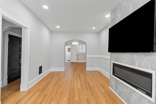 unfurnished living room with light hardwood / wood-style floors