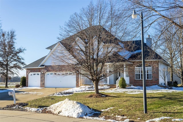 view of front property featuring a garage and a front yard