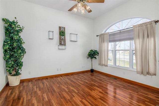 empty room featuring wood-type flooring and ceiling fan