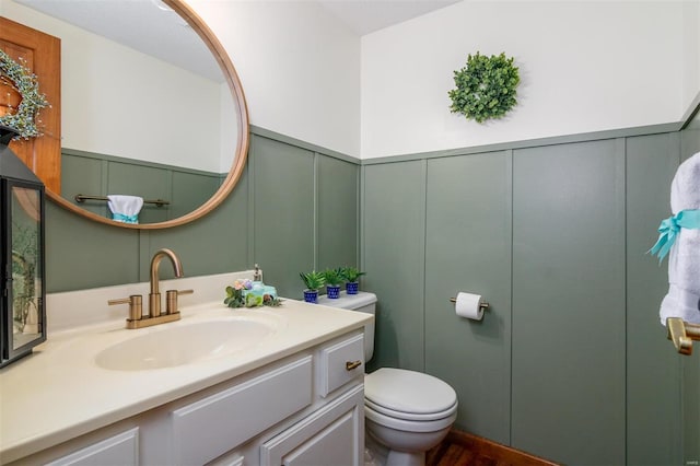 bathroom with vanity and toilet